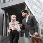 arabian business colleagues discussing work on str 33v4ggm