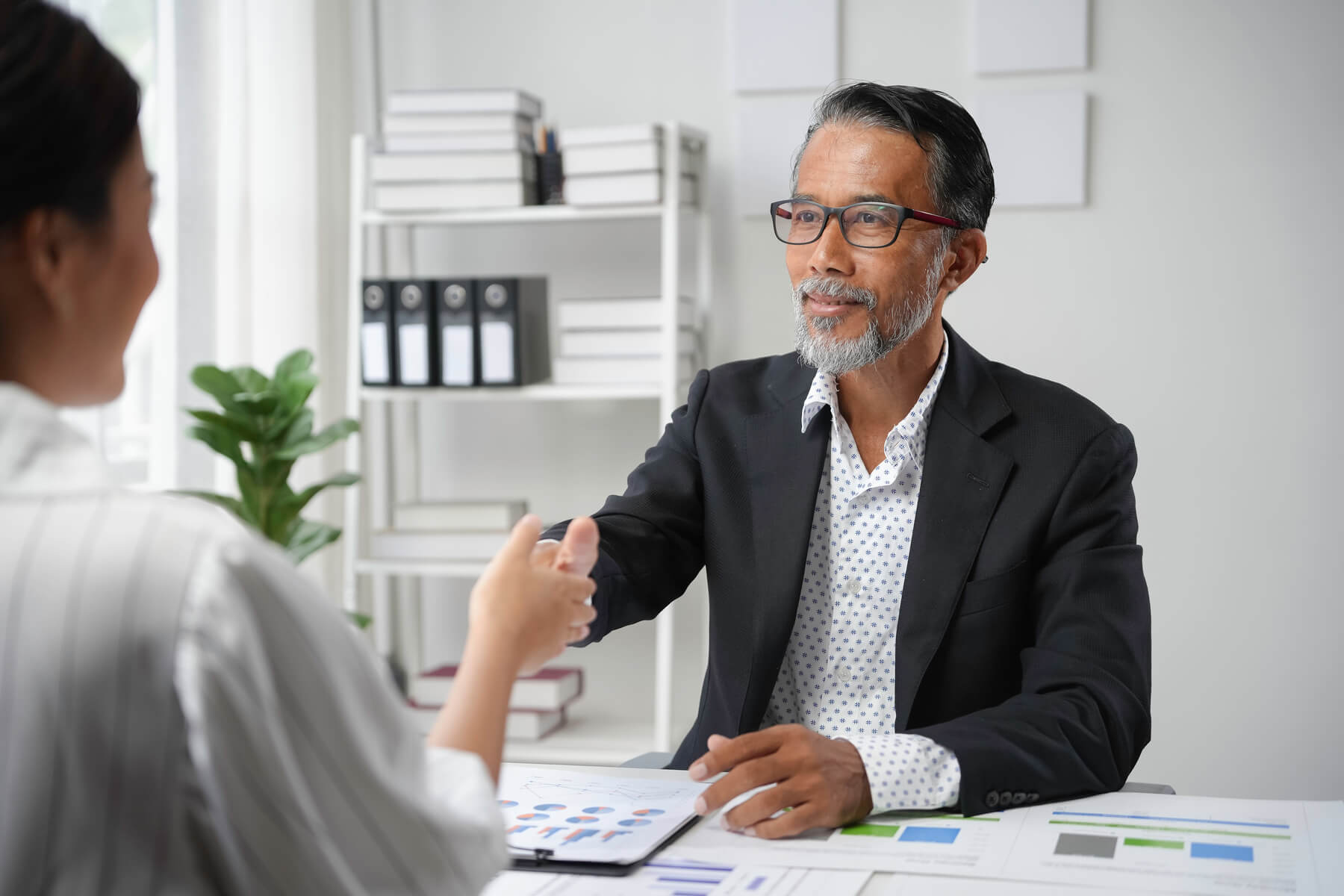 senior manager shaking hands with a young female p 2024 12 27 17 20 49 utc (1) (1)