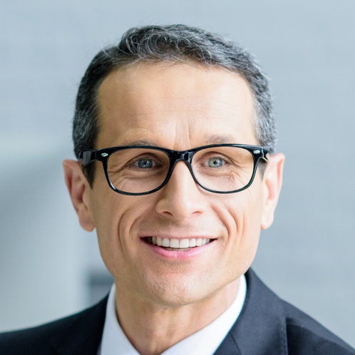 selective focus of smiling businessman talking to 2024 11 19 15 16 15 utc cropped.jpg